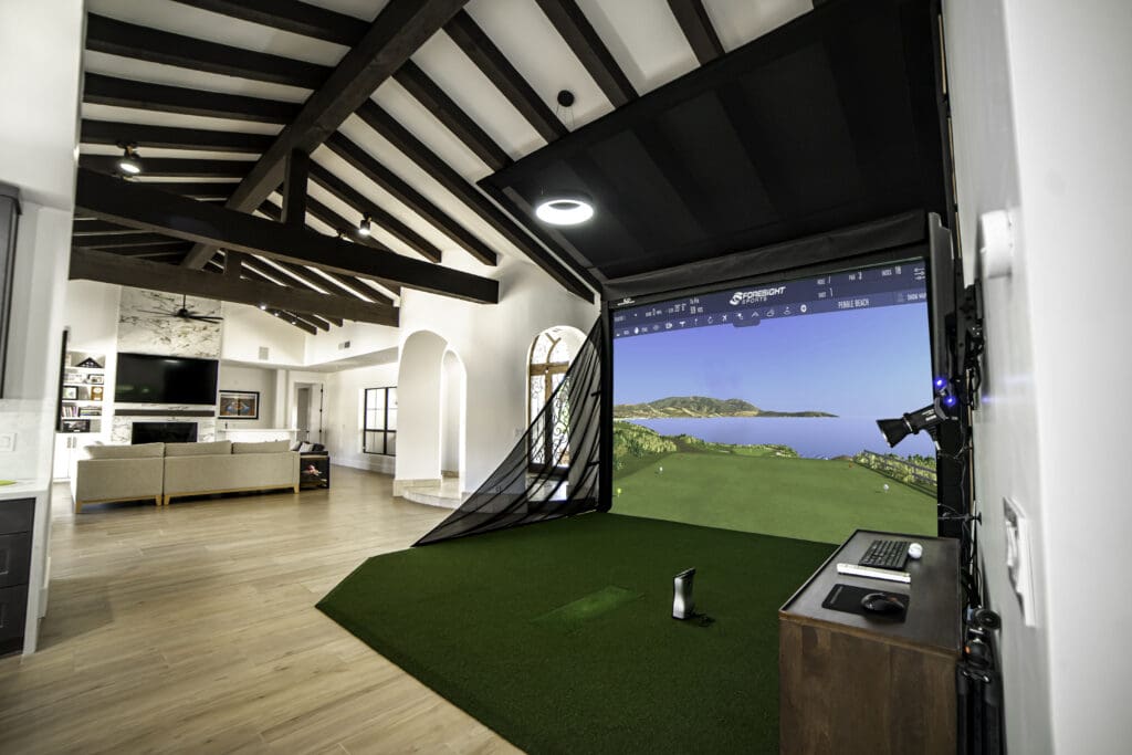 A state-of-the-art golf simulator transforms a cozy living room into an immersive golfing experience.